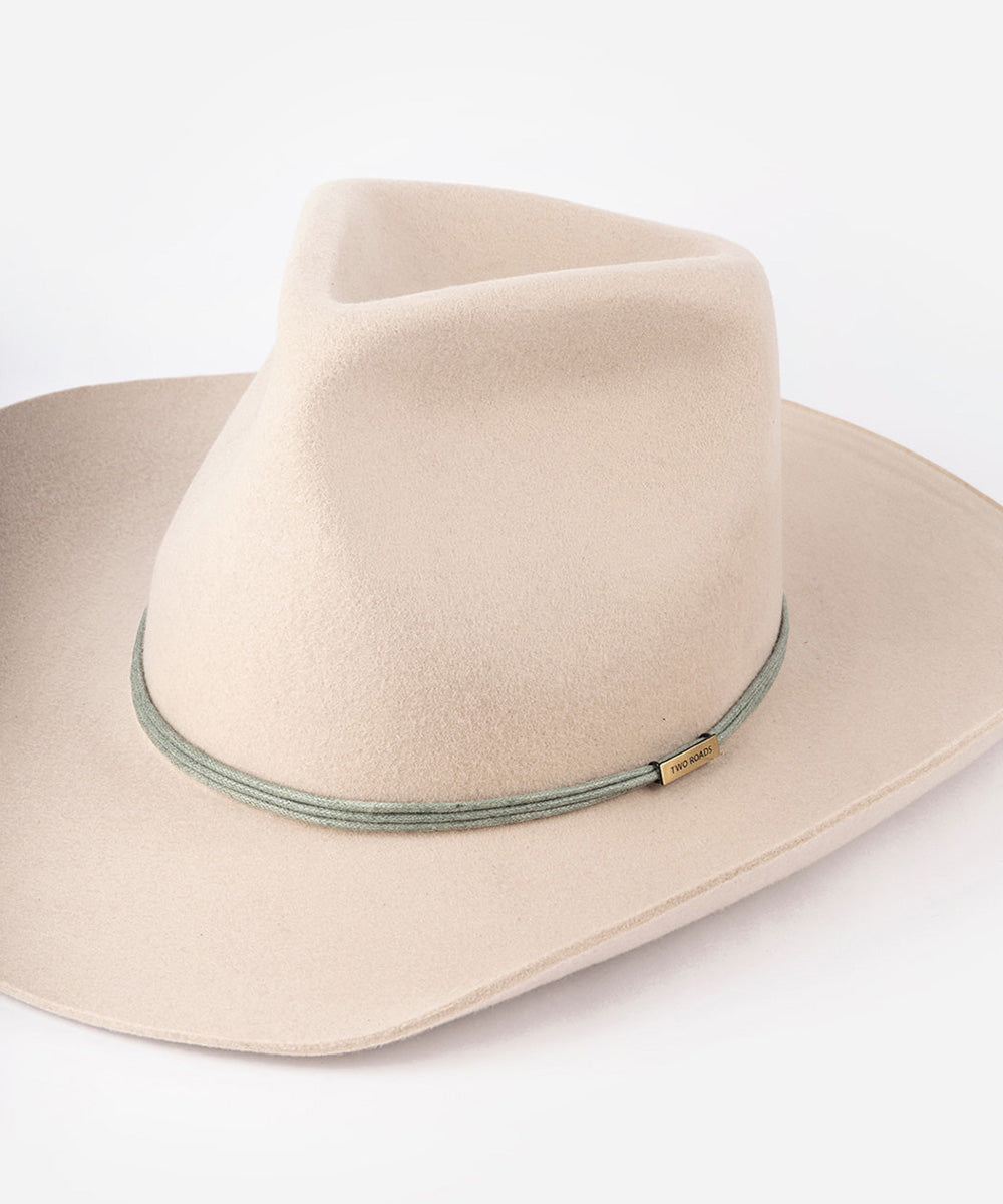 Beige cowboy hat with a leather band in a white background #color_olive