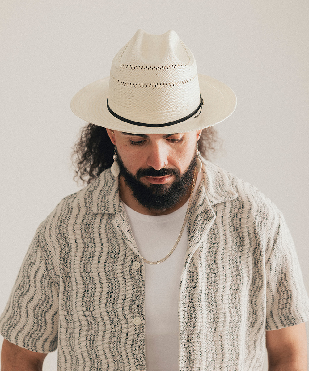 White straw hat with a black band on a white background #color_off white