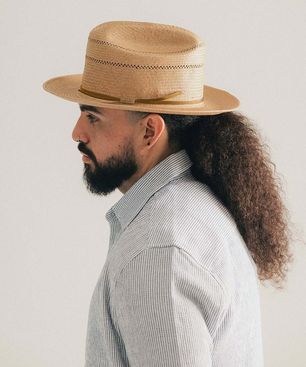Natural straw hat with a black band on a white background #color_natural
