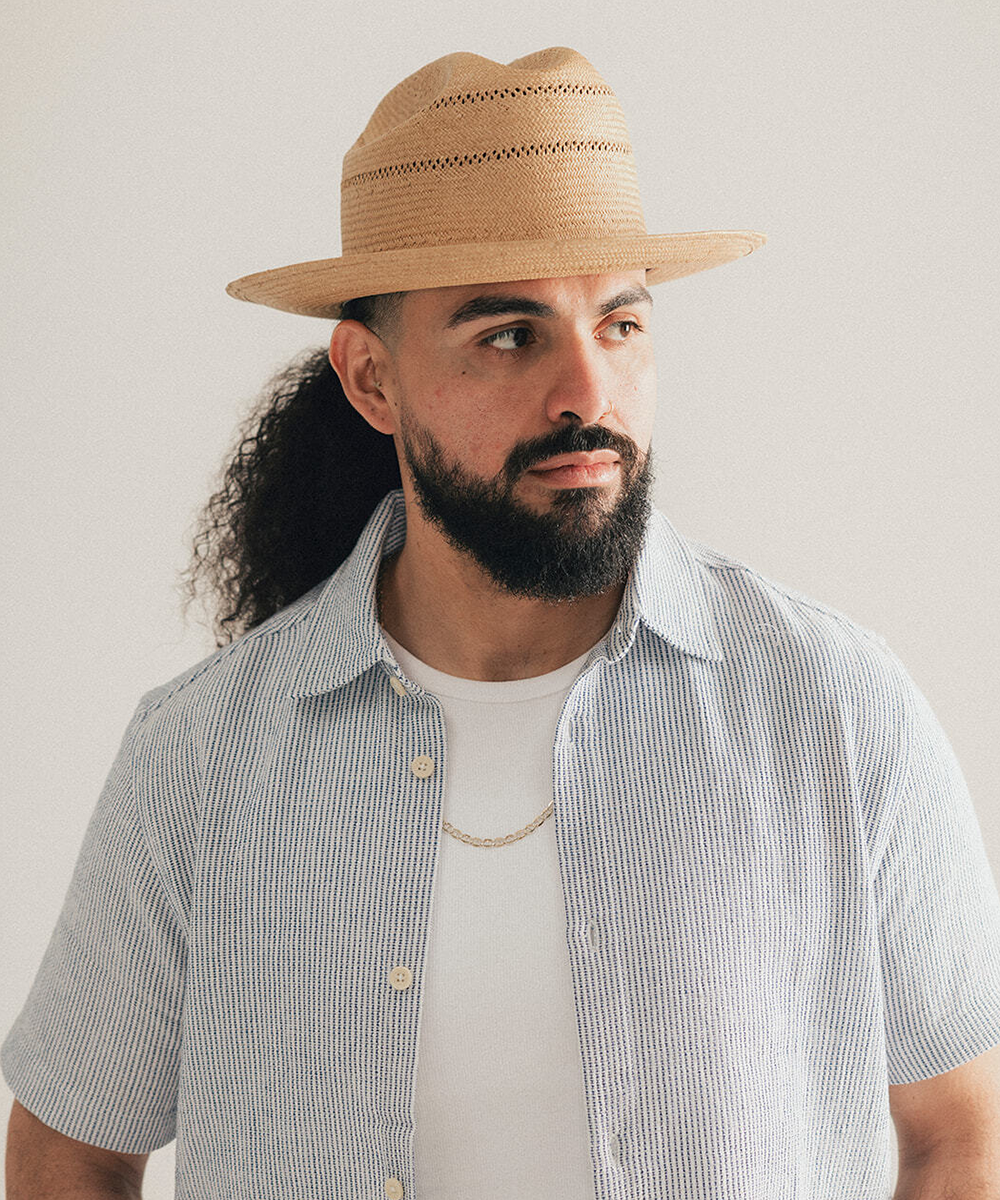 Natural straw hat with a black band on a white background #color_natural