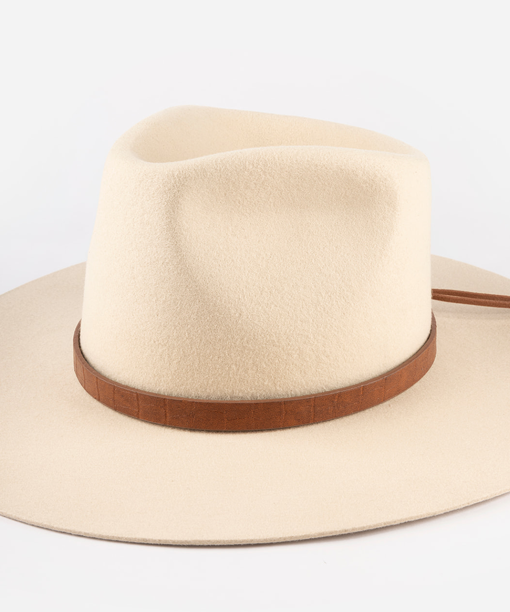 A cream-colored felt cowboy hat with a brown textured band, photographed on a clean white background #color_brown