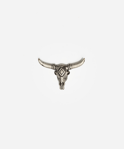A silver-toned metal stud earring shaped like a stylized longhorn skull with curved horns and a diamond motif on the forehead, centered on a plain light gray background #color_anti silver