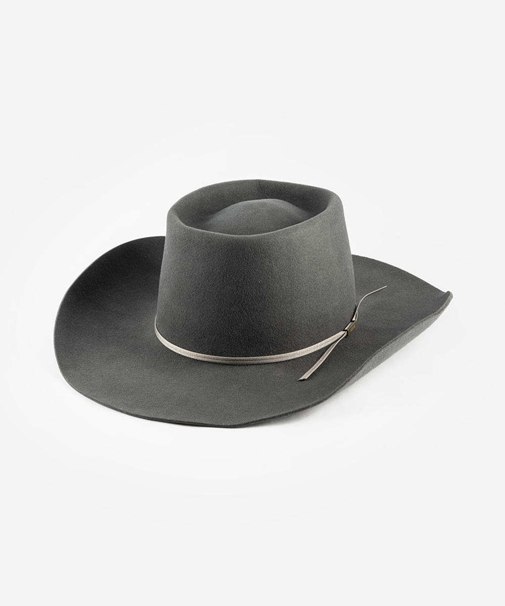 A dark gray felt cowboy hat with a thin silver band and a small silver feather accent, photographed on a clean white background #color_grey