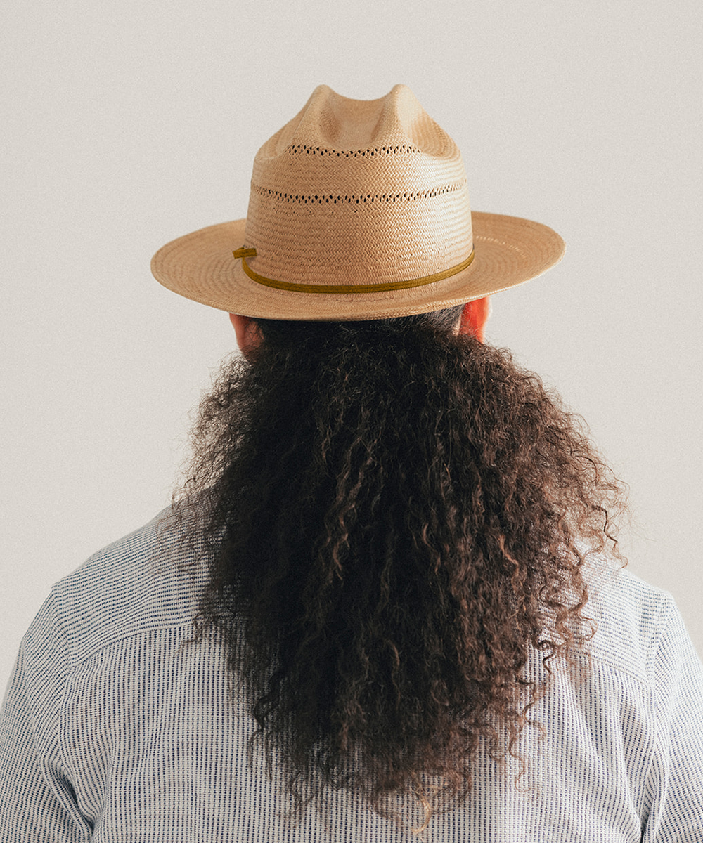 Natural straw hat with a black band on a white background #color_natural